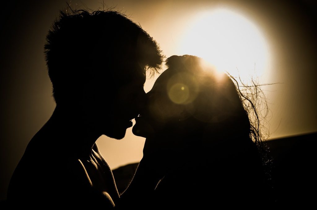 sunset couple kissing